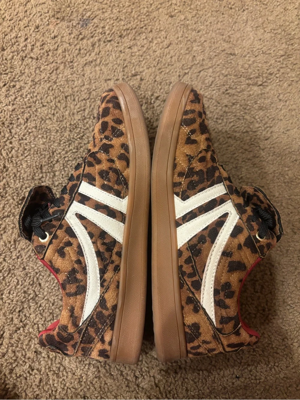 Steve Madden women’s Leopard Print Sneakers with Red Lining
